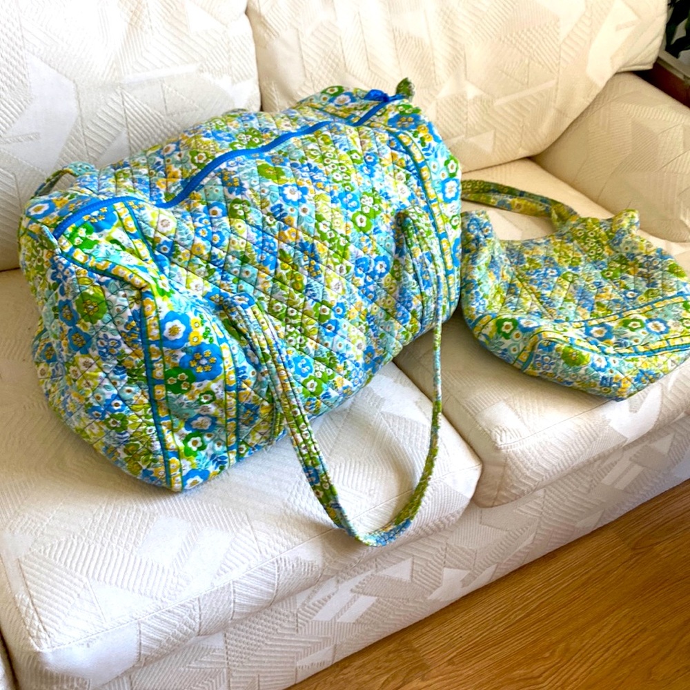 Large Vera Bradley duffel bag with matching purse.